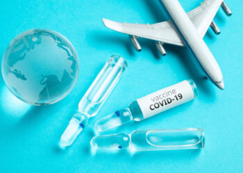 Concept for the worldwide delivery of COVID-19 coronavirus vaccine by plane.