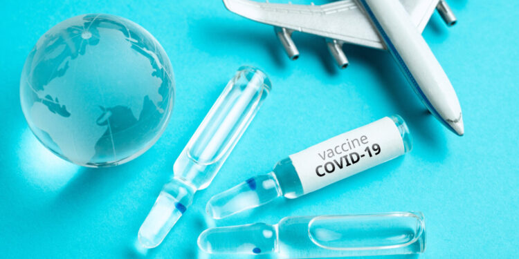 Concept for the worldwide delivery of COVID-19 coronavirus vaccine by plane.